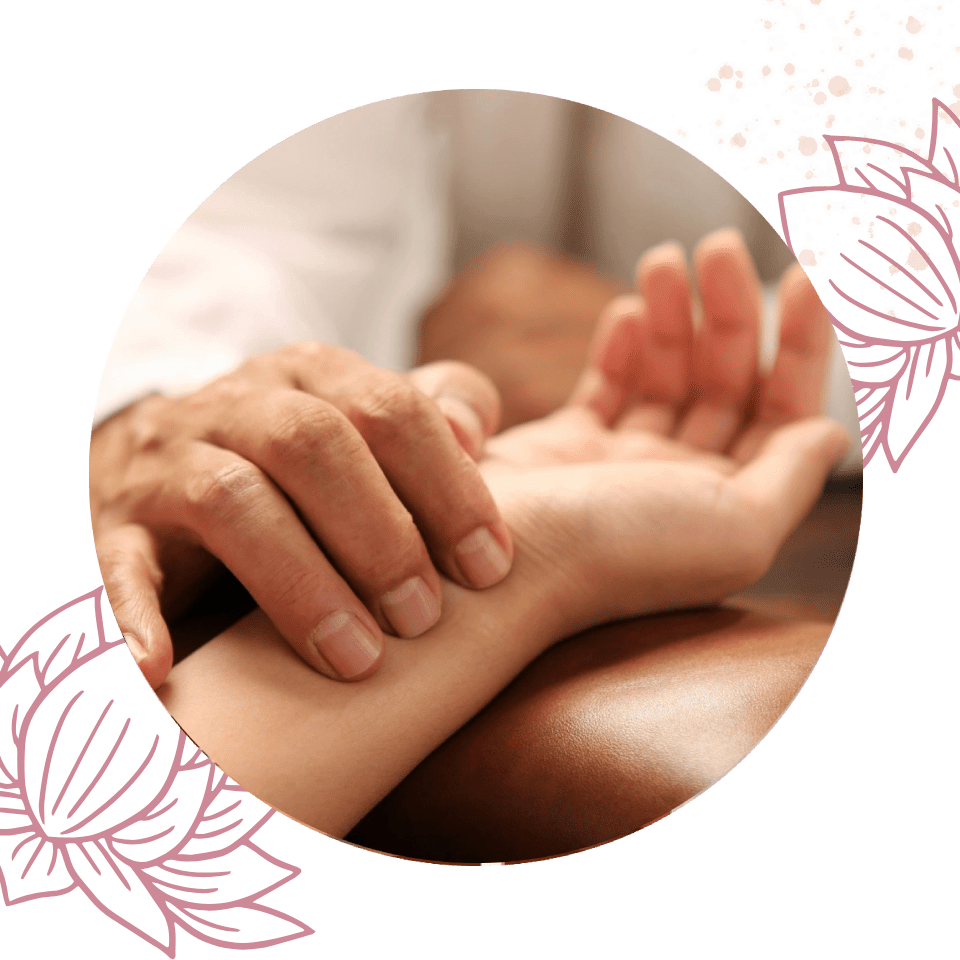 A person is holding their hand over another persons arm.